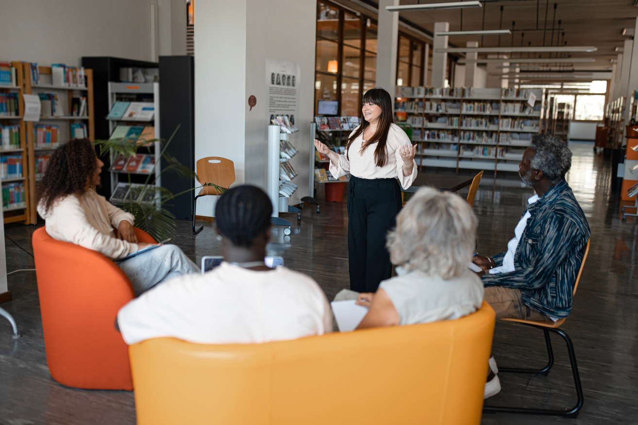 Group of Adult Students Studying in the Library 